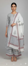 a white cotton floral block print kurta with pant and dupatta set