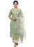 a green cotton printed kurta set with dupatta.